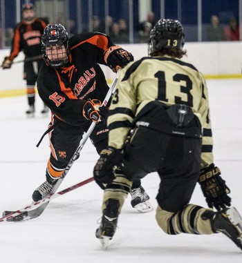 Westminster junior D Peter Horsfall makes KUA soph Roope Hirvonen work for his patch of ice.