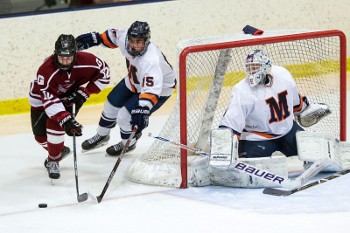 Milton sophomore D Tim Casilli (15) is doing all he can to match steps with Cam Donaldson (12), Gunnery’s leading scorer.