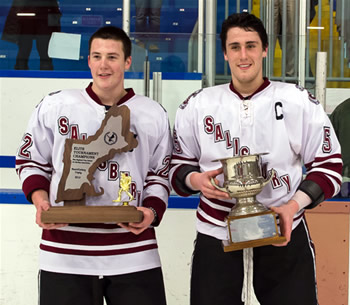 Salisbury co-captains Ryan Segalla (22) and Mark Hamilton (5) hold the hardware after Sunday's championship game.