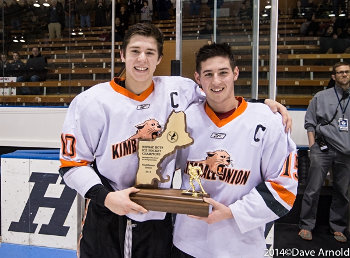 KUA co-captains AJ Greer and JD Dudek display some hardware after winning Sunday's Small School title with a 5-1 win over Dexter