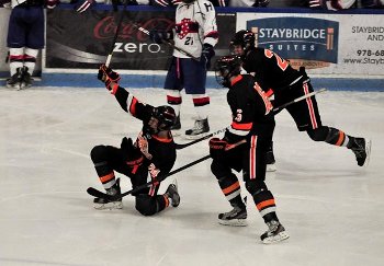 KUA junior Niko Rufo celebrates his third period goal against Holderness.