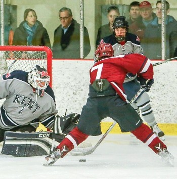 Avon's Patrick Harper on the doorstep -- fun for the fans, but not so much so for Kent goaltender Peter Negron. Harper, with a 6-4-10 line in four gam