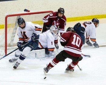 Chaos in front as Albert Washco (10) and Matt Danner (16) attack the Milton net.