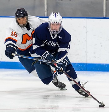 Milton's Brandon Tang chases Hotchkiss' Brendan Heywood in Friday action at the Flood-Marr.