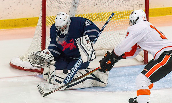 Kent junior G Joey Purtell stops KUA's Bryce Bollman in Sunday's 5-2 win at the Exeter Tournament. Purtell turned away 43 of 45 shots to knock off the
