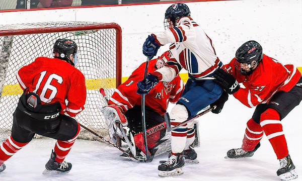 Dexter's Patrick Morrissey gets some stick flex against the pads of Rivers' goalie Casen Janko during Dexter's 6-1 victory Wed. Jan. 8th. Ryan Bell (#