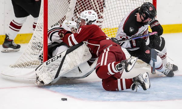 Governor's F Michael Marchese (#11) demonstrates how to crash the net during Gov's 3-3 tie vs. Middlesex Friday night. Middlesex goalie is soph Caio B