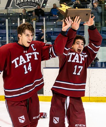 Taft senior captains JJ Lemieux and Zave Greene skate the Large School Championship plaque around the ice after edging Salisbury, 3-2 in overtime, Sun