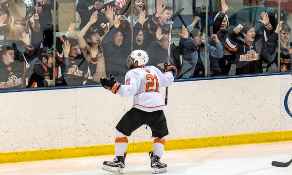 Kimball Union senior Andranik Armstrong celebrates what proved to be the GWG with the Wildcats' student section. Armstrong had two goals in Sunday's E