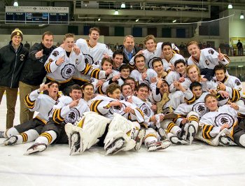 Brunswick celebrates its Large School Championship after a 4-3 OT win over Thayer.