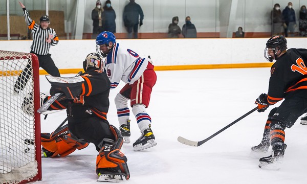 Senior Cooper Boulanger, shown here scoring a first-period goal, would later add two assists as #10-ranked Holderness blanked NYA, 6-0, in Yarmouth, M